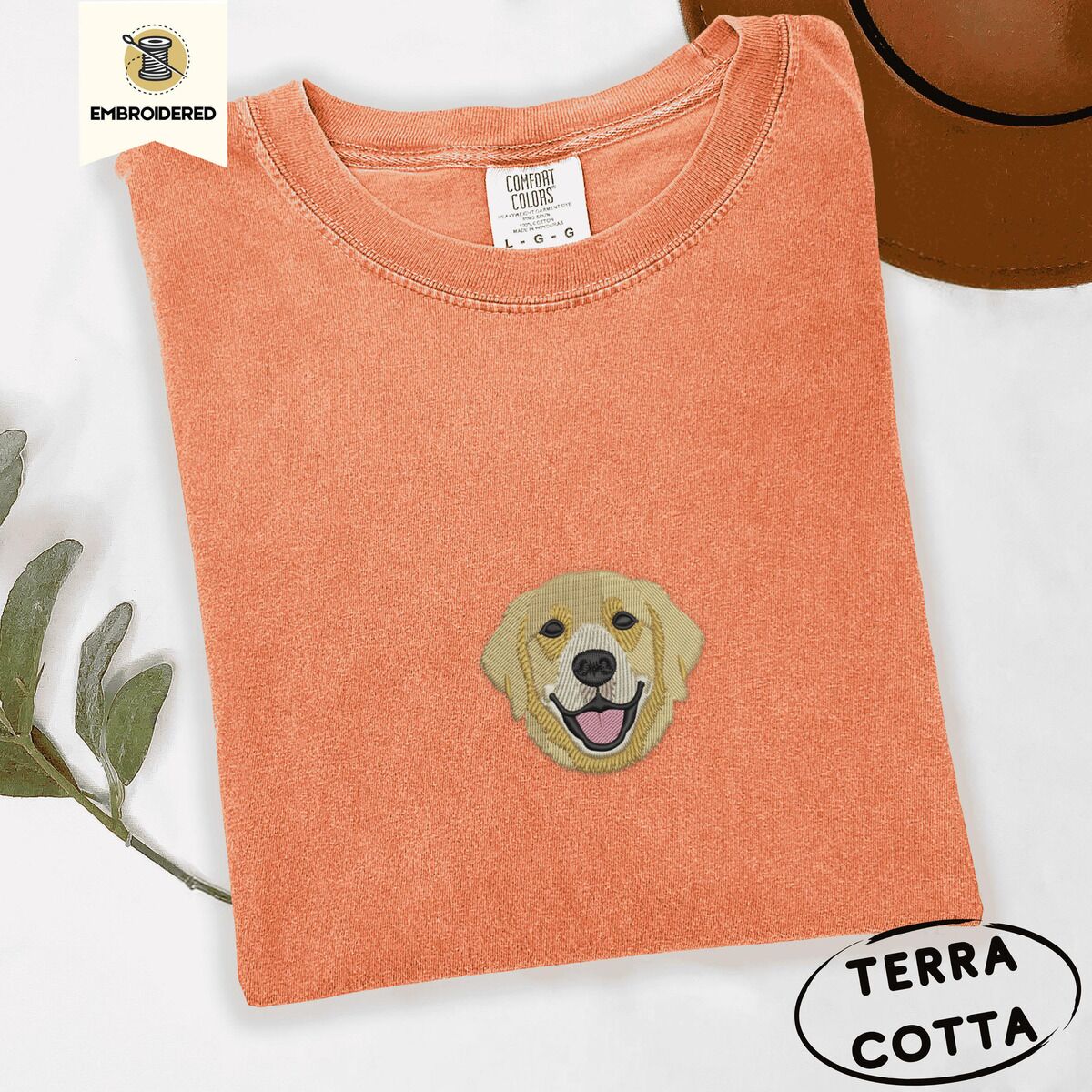 Golden Retriever Face Shirt – Terracotta Terracotta Comfort Colors T-shirt embroidered with a smiling golden retriever face with a pink tongue