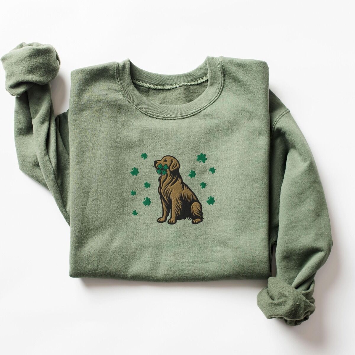 Golden Retriever Four Leaf Clover Sweatshirt – Military Green Military Green crewneck sweatshirt laid flat, embroidered with a sitting golden retriever holding a four leaf clover in its mouth, ringed by green shamrocks