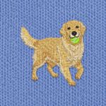 Close-up of the embroidered golden retriever with a lime green tennis ball in its mouth and a feathered tail, on blue fleece