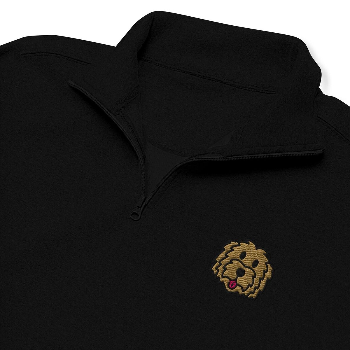 Goldendoodle Quarter Zip – Black Close-up of a Black quarter zip collar and chest, embroidered with a shaggy golden doodle face