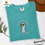 Seafoam Comfort Colors T-shirt embroidered with a cool white goose in black sunglasses with arched white lettering embroidered on the chest