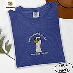 True Navy Comfort Colors T-shirt embroidered with a cool white goose in black sunglasses with arched white lettering embroidered on the chest