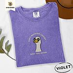 Violet Comfort Colors T-shirt embroidered with a cool white goose in black sunglasses with arched white lettering embroidered on the chest