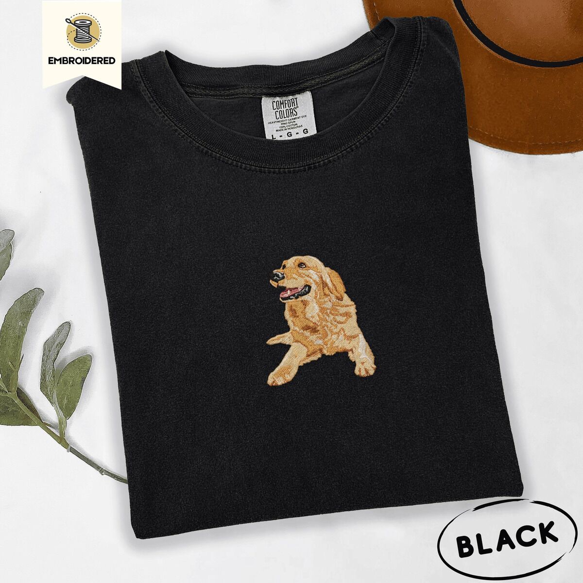 Happy Golden Retriever Shirt – Black Black Comfort Colors T-shirt embroidered with a happy golden retriever lying down with its head up and tongue out