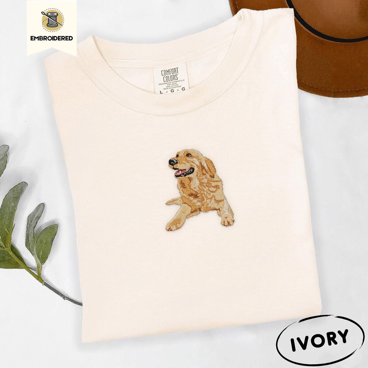 Happy Golden Retriever Shirt – Ivory Ivory Comfort Colors T-shirt embroidered with a happy golden retriever lying down with its head up and tongue out