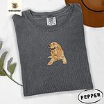 Pepper Comfort Colors T-shirt embroidered with a happy golden retriever lying down with its head up and tongue out