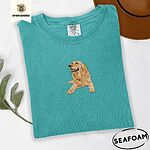 Seafoam Comfort Colors T-shirt embroidered with a happy golden retriever lying down with its head up and tongue out