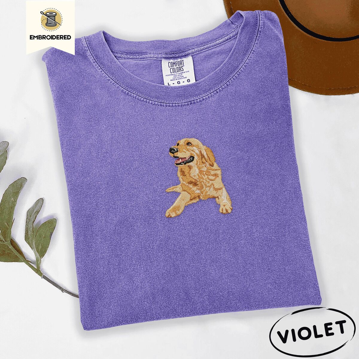 Happy Golden Retriever Shirt – Violet Violet Comfort Colors T-shirt embroidered with a happy golden retriever lying down with its head up and tongue out