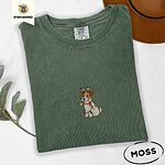 Moss Comfort Colors T-shirt embroidered with a white and tan Jack Russell puppy in a reindeer headband chewing a string of Christmas lights