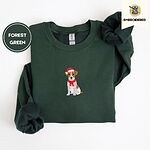 Forest Green Jack Russell Christmas sweatshirt folded on a white background, with a mini embroidered Jack Russell puppy in a Santa hat and red scarf centered on the chest