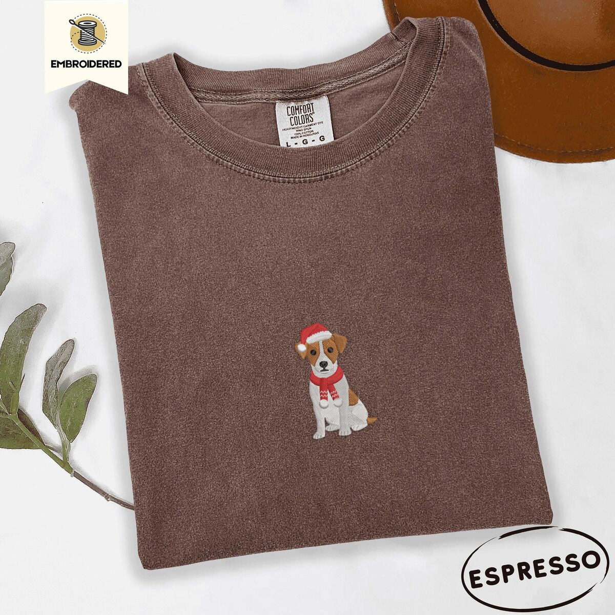 Jack Russell Santa Hat Shirt – Espresso Espresso Comfort Colors T-shirt embroidered with a mini Jack Russell Terrier puppy in a red Santa hat and a knitted red scarf