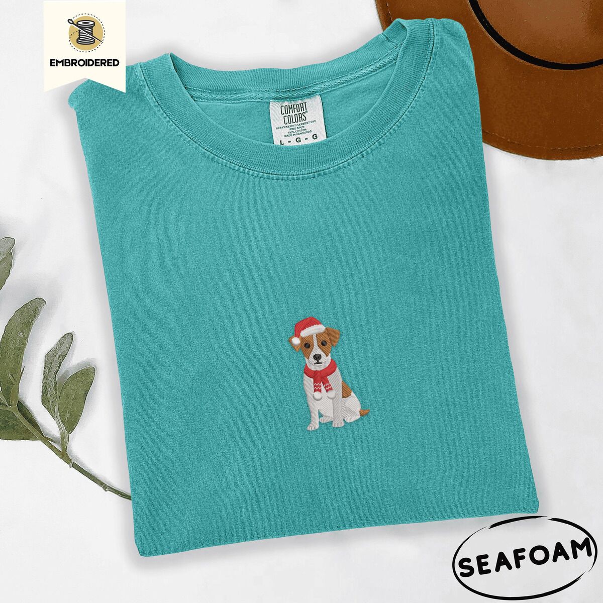 Jack Russell Santa Hat Shirt – Seafoam Seafoam Comfort Colors T-shirt embroidered with a mini Jack Russell Terrier puppy in a red Santa hat and a knitted red scarf