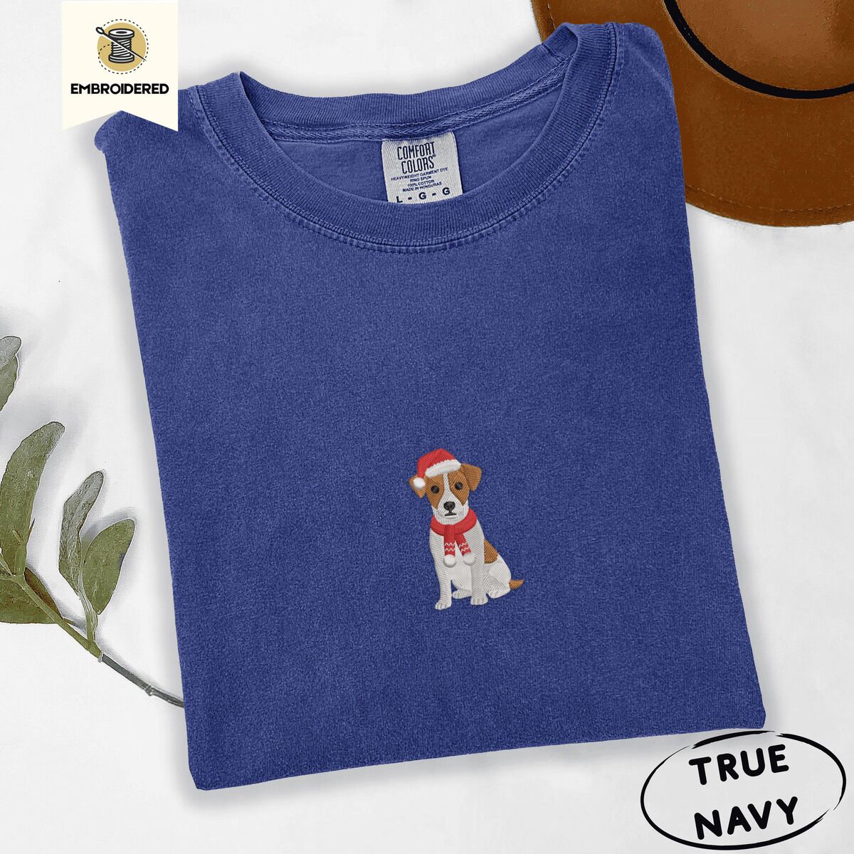 Jack Russell Santa Hat Shirt – True Navy True Navy Comfort Colors T-shirt embroidered with a mini Jack Russell Terrier puppy in a red Santa hat and a knitted red scarf