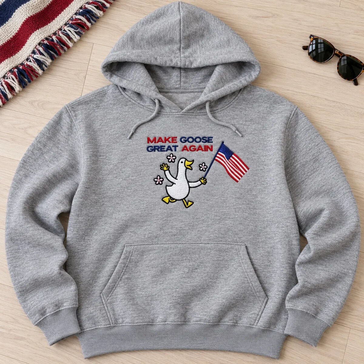 Make Goose Great Again Hoodie – Sport Grey Sport grey hoodie with the embroidered Make Goose Great Again goose and flag