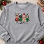 Embroidered Meowy Christmas sweatshirt in Sport Grey with four cats in Christmas sweaters and hats across the chest