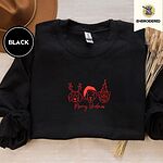 Black crewneck sweatshirt with a brown felt hat and dried bunny tail grass, embroidered with three red line-art dog faces, a beagle in reindeer antlers, a retriever in a Santa hat and a pug in a party hat, above Merry Woofmas in script