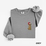 Grey crewneck sweatshirt laid flat, embroidered with a curly goldendoodle in a red Santa hat on the left chest