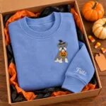 Miniature Schnauzer Halloween sweatshirt folded in a gift box with mini pumpkins