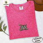 Crunchberry Comfort Colors T-shirt embroidered with a fluffy brown tabby kitten peeking over a ledge at a pink butterfly