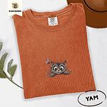Yam Comfort Colors T-shirt embroidered with a fluffy brown tabby kitten peeking over a ledge at a pink butterfly