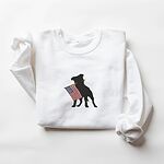White crewneck sweatshirt laid flat, embroidered with a black pit bull and a red, white and blue flag