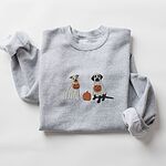 Sport Grey crewneck sweatshirt laid flat on a white background, embroidered with a pit bull and a black lab in ghost sheets holding jack-o'-lantern buckets