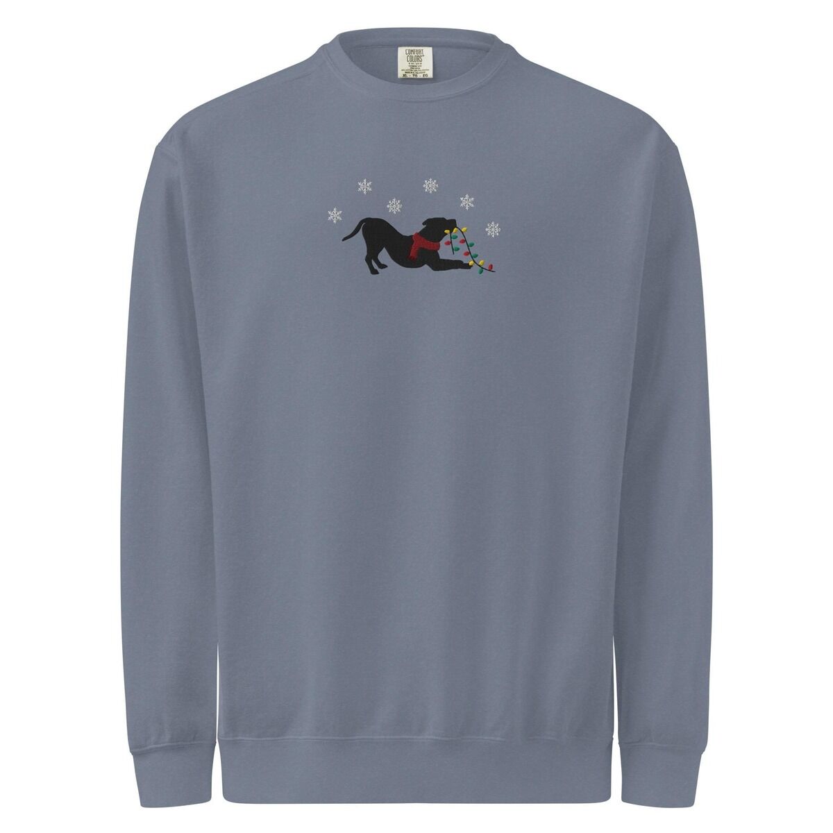 Pitbull Christmas Lights Sweatshirt – Blue Jean Blue Jean crewneck sweatshirt shown flat on a white background, embroidered with a black pitbull silhouette in a play bow with a red scarf, holding a string of Christmas lights under white snowflakes