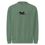 Light Green crewneck sweatshirt shown flat on a white background, embroidered with a black pitbull silhouette in a play bow with a red scarf, holding a string of Christmas lights under white snowflakes