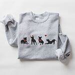Sport Grey crewneck sweatshirt laid flat, embroidered with four black pitbull silhouettes with red bandanas, a red heart headband and a floating red heart
