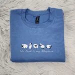 Psalm 23 sweatshirt in blue with five embroidered sheep above the Lord is my Shepherd in white script
