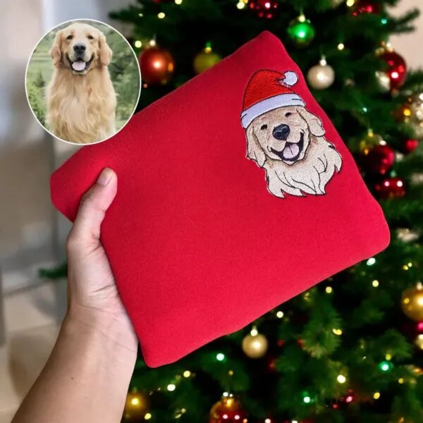 Santa hat dog sweatshirt in red with an embroidered golden retriever portrait made from the dog photo shown beside it