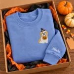 Shih Tzu Halloween sweatshirt folded in a gift box with mini pumpkins