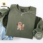 Military Green crewneck sweatshirt folded with light jeans and a silver chain necklace, embroidered with a gold and white Shih Tzu puppy with a long silky coat and a plumed tail