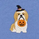 Close-up of the embroidered Shih Tzu in a witch hat with a jack-o'-lantern candy bucket