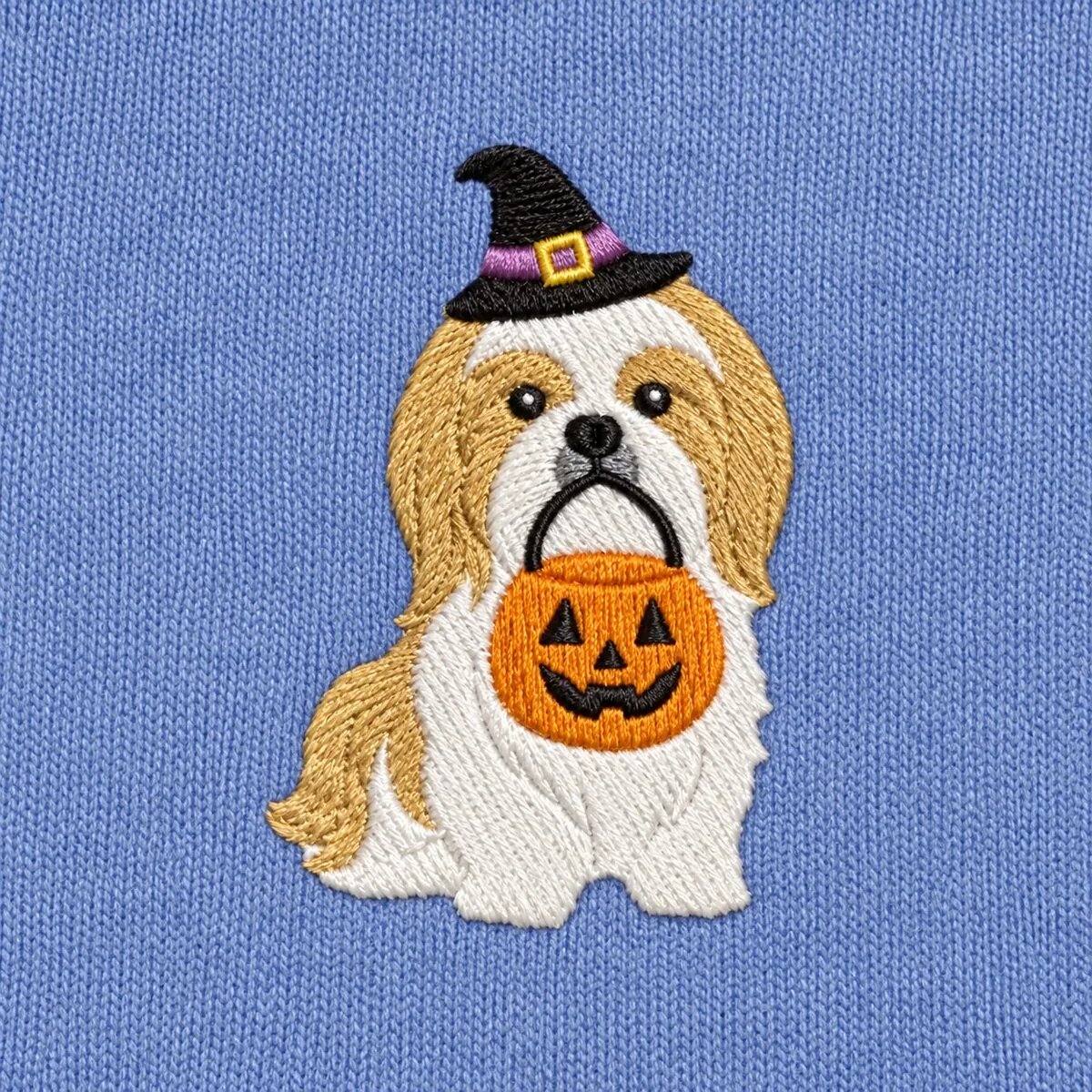 Shih Tzu Witch Hat Embroidery Close-up Close-up of the embroidered Shih Tzu in a witch hat with a jack-o'-lantern candy bucket