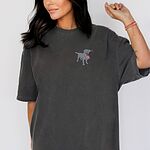 Woman in a Pepper T-shirt with a small silver lab and USA flag embroidered on the left chest