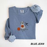 Blue Jean crewneck sweatshirt laid flat with rolled cuffs, embroidered with a silver Labrador in a white ghost sheet holding a jack-o'-lantern bucket beside a pumpkin and three bats