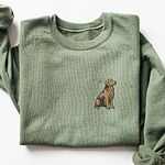 Military Green crewneck sweatshirt laid flat, embroidered with a small sitting golden retriever on the left chest