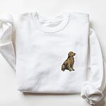White crewneck sweatshirt laid flat with a rolled cuff, embroidered with a small sitting golden retriever on the left chest