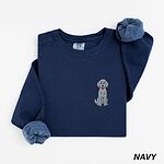 True Navy crewneck sweatshirt laid flat, embroidered with a small light grey goldendoodle sitting on the left chest