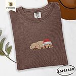 Espresso Comfort Colors T-shirt embroidered with a golden retriever puppy napping with its head on its paws in a red Santa hat