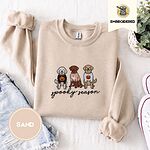 Sand crewneck sweatshirt folded with denim shorts, white sneakers and a potted plant, embroidered with a doodle, a chocolate lab and a golden retriever in Halloween sweaters above spooky season in script