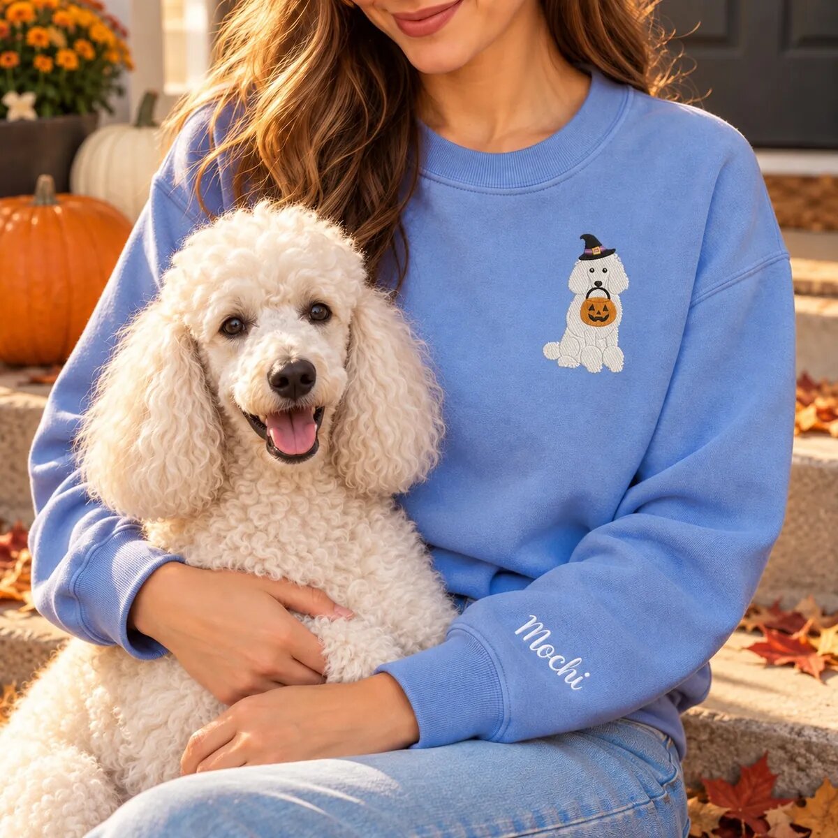 Standard Poodle Mom Halloween Sweatshirt Worn Standard Poodle mom wearing the Heather Deep Royal Halloween sweatshirt with her Standard Poodle on a fall porch