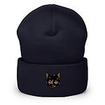 Navy cuffed knit beanie with a tortoiseshell cat face, black with caramel patches, embroidered on the cuff