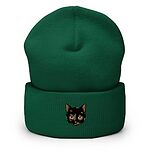 Spruce cuffed knit beanie with a tortoiseshell cat face, black with caramel patches, embroidered on the cuff