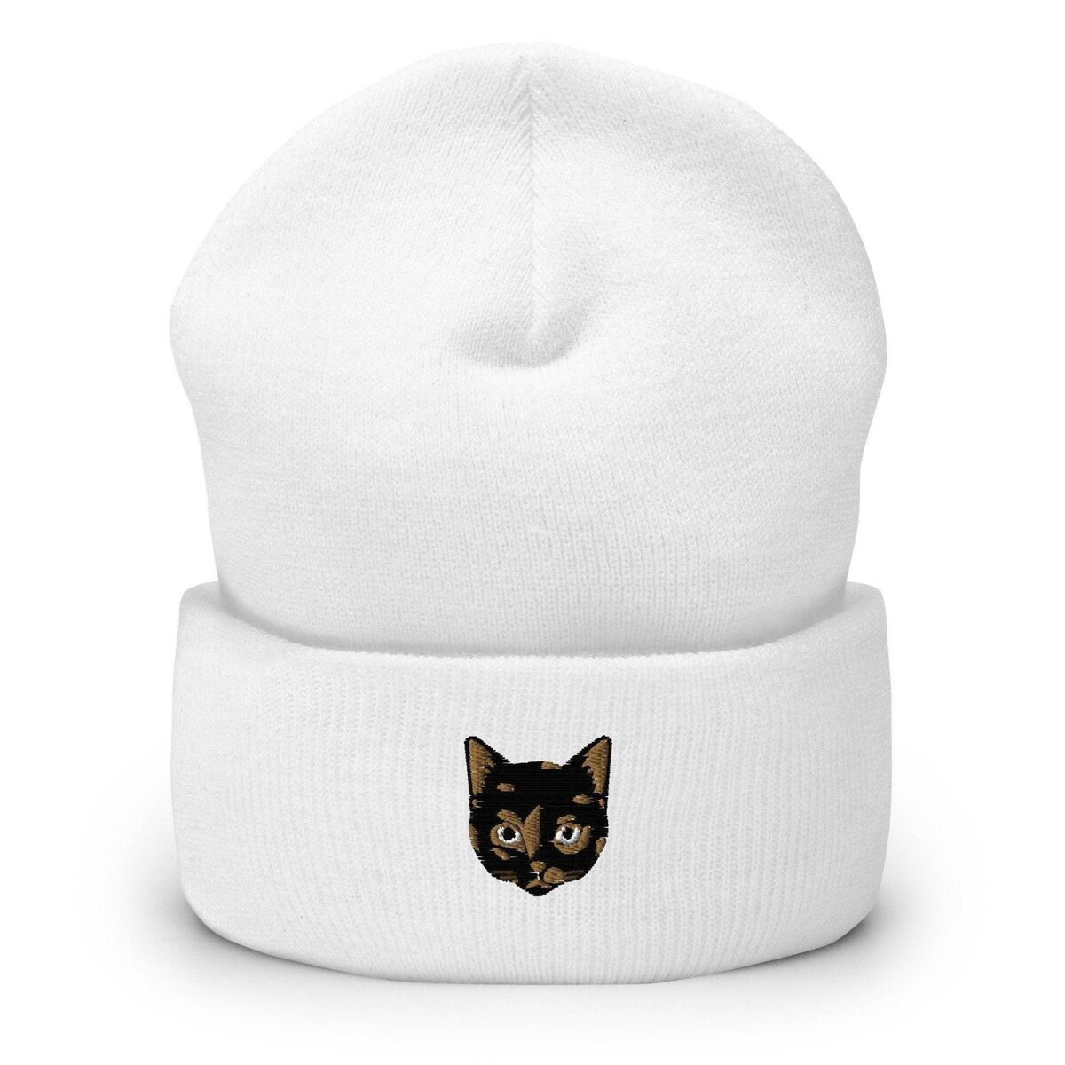Tortie Cat Beanie White White cuffed knit beanie with a tortoiseshell cat face, black with caramel patches, embroidered on the cuff