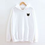 White pullover hoodie on a wooden hanger against a white wall, embroidered with a small tortoiseshell cat face, black with golden caramel patches, on the left chest