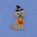 Close-up of the embroidered Toy Poodle in a witch hat with a jack-o'-lantern candy bucket