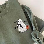 Folded Military Green crewneck sweatshirt with the ghost and black cat embroidered on the left chest and a rolled cuff