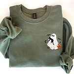 Military Green Gildan 18000 crewneck sweatshirt laid flat with a ghost holding a black cat and a pumpkin pail embroidered on the left chest